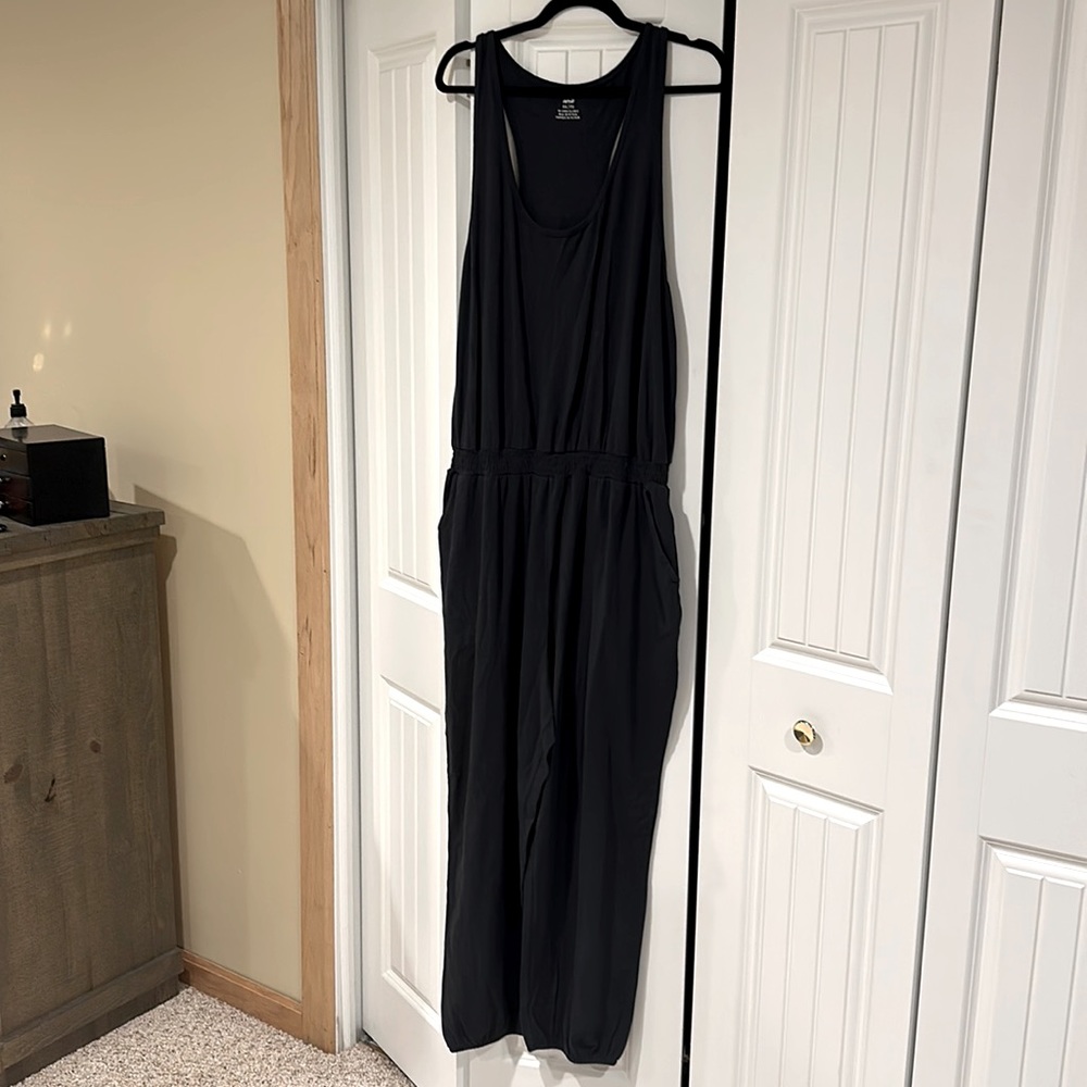 Very cute dark grey jumpsuit with fitted ankle.